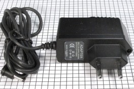 Блок питания импульсный 12V 1A шт.1,7*4*9мм корпус с вилкой